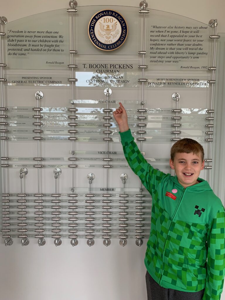 A child standing in front of a display at Reagan Presidential Library